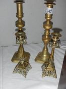 2 pairs of brass candlesticks.