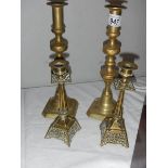 2 pairs of brass candlesticks.