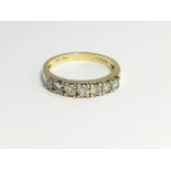 An 18ct yellow gold 7 stone diamond bar ring, 3.6 grams, size M.