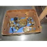 A box of assorted brass ware including bellows, candlesticks etc.