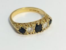 A 1980's 3 stone sapphire and diamond ring in 18ct yellow gold, size P.