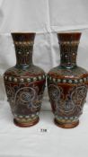 A pair of 1875 Doulton Lambeth vases by George Tinworth (monogram on side of each vase) with