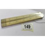 A 24" ivory folding ruler.