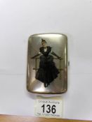 A continental silver cigarette case with a figure of a lady on the front, marked 800.