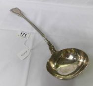 A Victorian silver soup ladle.