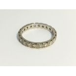 An 18ct gold and diamond eternity ring, size L.
