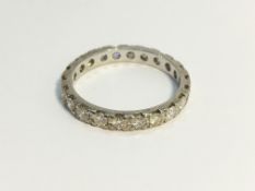 An 18ct gold and diamond eternity ring, size L.