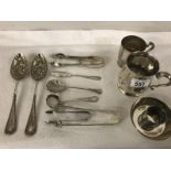 A mixed lot of silver plate including tankards, sugar tongs, berry spoons etc.