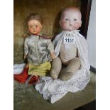 An Armand Marseille porcelain headed doll and another 19th century continental porcelain headed