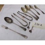 2 early silver sugar nips and assorted silver cutlery.