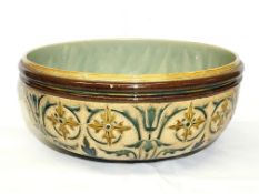 A large Doulton Lambeth 1883 bowl with artists marks of George Hugo Tabor and Harriett E Hibbut.