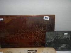 A large copper plate printing block of an orchestra and a printing block of a steam engine.