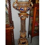 A magnificient majolica jardiniere on stand.