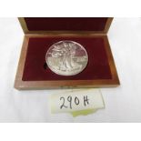 A U.S.A one pound Eagle 1986 Liberty fine silver coin in case.