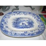 A large blue and white meat platter.