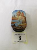 A signed Russian lacquered snuff box depicting a hand painted lake scene.