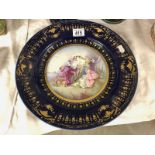 A large continental porcelain hand decorated plate, a/f.