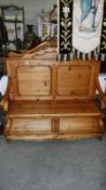 A carved pine monks bench