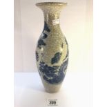 A blue and white crackle glaze vase decorated with a dragon. Approximate height 29cm/ 11 1/2".