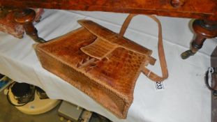 A Conmer, U.S.A alligator skin hand bag.