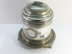 A silver plated biscuit barrel.