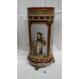 A tall heavy Mettlach spill type vase on 4 green feet with 4 panels each depicting a woman in the