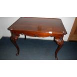 A mahogany cabriole leg coffee table.