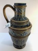 A Doulton Lambeth jug 1877 by Florence E Barlow, Emma Martin and Mary Butter and inscribing 'JB7'.