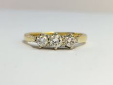 An 18ct yellow gold 3 stone diamond ring, size J.