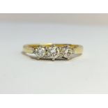 An 18ct yellow gold 3 stone diamond ring, size J.