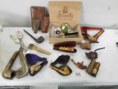 A mixed lot of vintage pipes, cheroot holders etc.