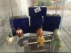 7 boxed "History of Faberge' Eggs" trinket boxes.