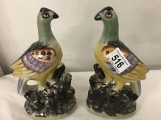 A pair of Staffordshire pottery 'Pigeons', approximately 25 cm tall.