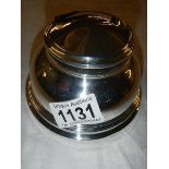 A silver inkwell (missing liner).
