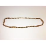 A hall marked 9ct gold vintage Albert chain, approximately 28.5 grams.