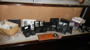 A collection of stereoscopes and cards.