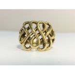 A 9ct gold ring with scroll design, size Q.