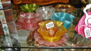 6 multicoloured handkerchief style glass dishes and 4 shallow dishes.