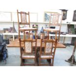 An oak dining table and 6 chairs.