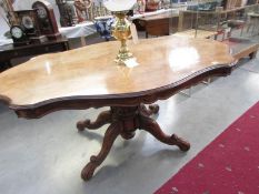 An old centre pedestal birds eye maple dining table.