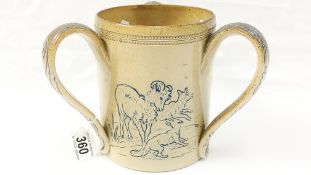 A Doulton Lambeth tyg with goats, trees and a dog or fox, Hannah Barlow and other identifying marks.