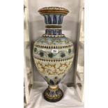 A huge Royal Doulton urn with stylised leaves mainly in blues and browns,