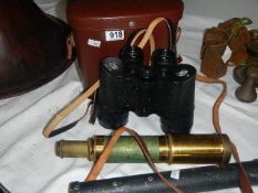 A pair of Carl Zeiss 10 x 50 binoculars, a brass telescope and one other item.