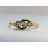 An 18ct gold ring set with 3 diamonds, hall marked Birmingham, BMS. size O.
