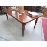 An old mahogany wind out table with string inlay and complete with winding handle.