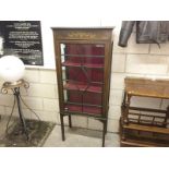 An Edwardian inlaid display cabinet