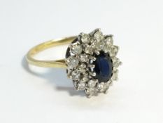 An 18ct yellow gold sapphire and diamond ring, size J half.