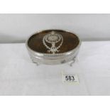 A silver plate and faux tortoise shell powder box.