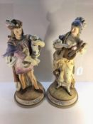 A fine pair of continental porcelain figures, 33 cm tall.