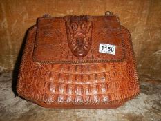 A vintage crocodile skin hand bag.